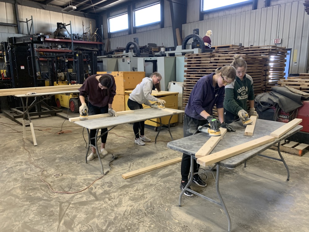 Students building beds