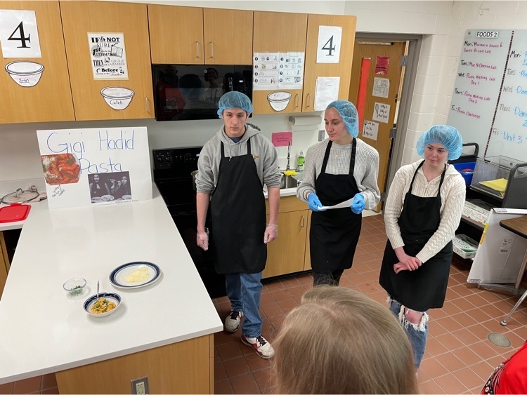 group of students presenting their pasta