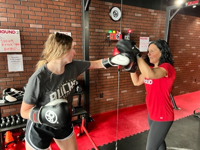student and teacher kickboxing