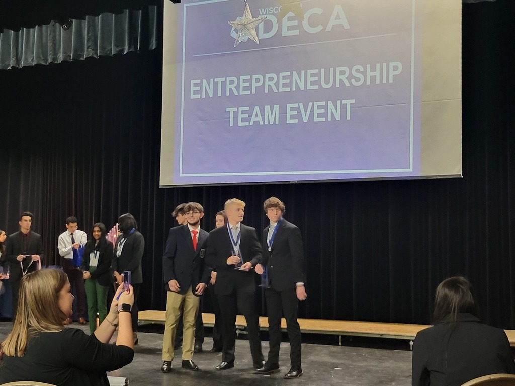 DECA students on stage